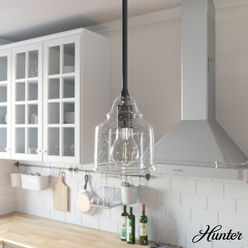 19657_1_dunshire_bell_clear_seeded_glass_1_light_6_inch_mini_pendant-noble_bronze-lifestyleimages1c