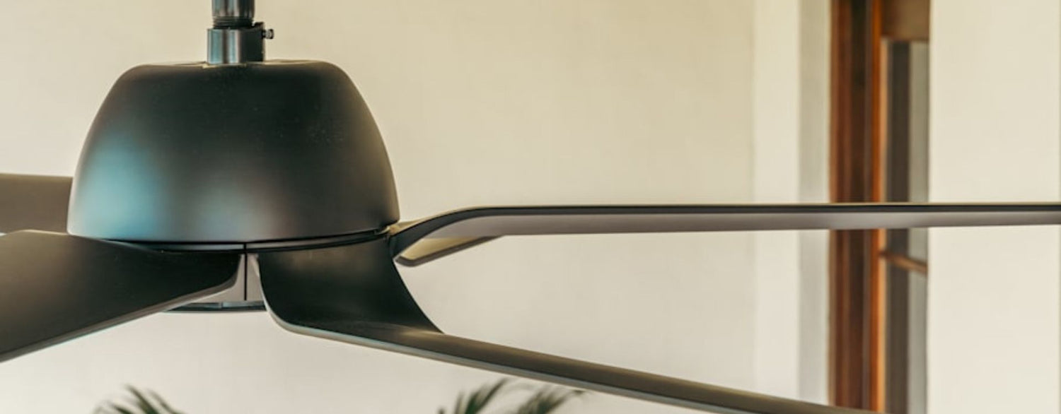 Close-up product detail highlighting the distinctive stacked blade design and sculpted housing of the AirStack outdoor ceiling fan, emphasizing its innovative airflow engineering.