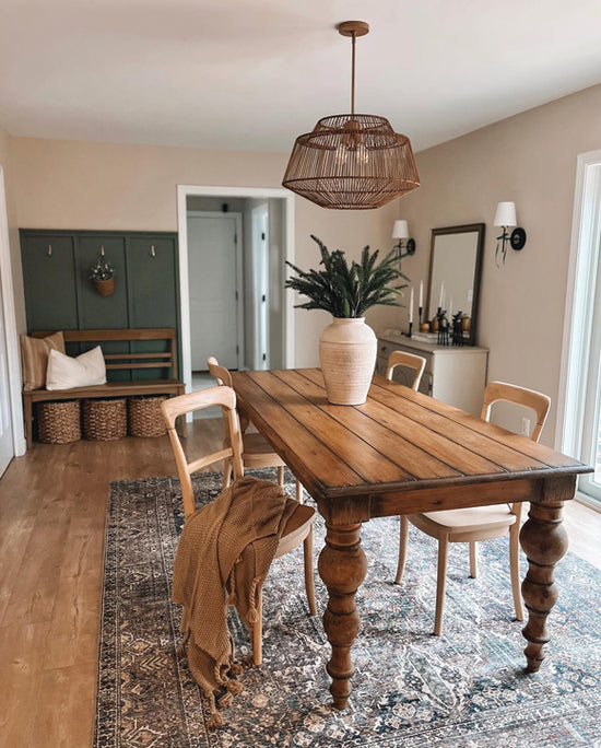 Brookhollow Pendant in sable rattan finish over dining table.
