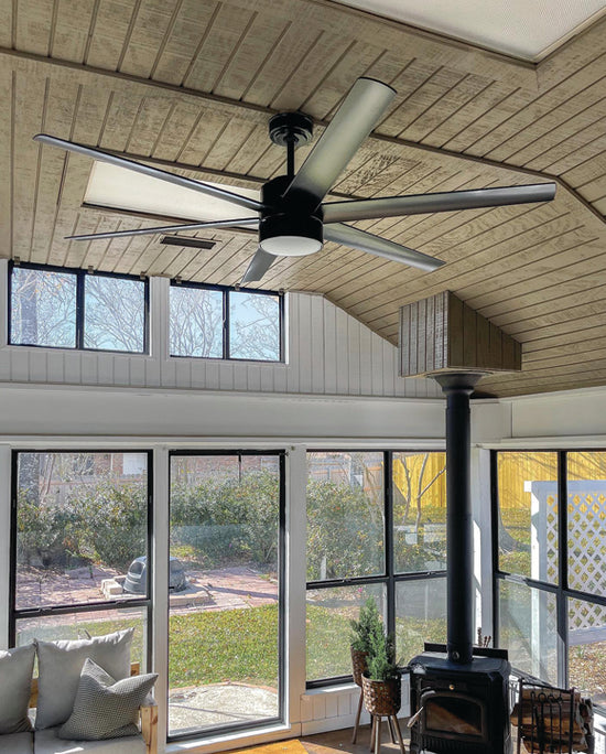 Solaria Outdoor Ceiling Fan in matte black finish mounted in sun room.