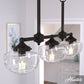 19491_1_saddle_creek_clear_seeded_glass_3_light_linear_chandelier-noble_bronze-lifestyleimages1c