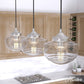 19497_1_saddle_creek_clear_seeded_glass_3_light_linear_pendant_cluster-brushed_nickel-lifestyleimages1c