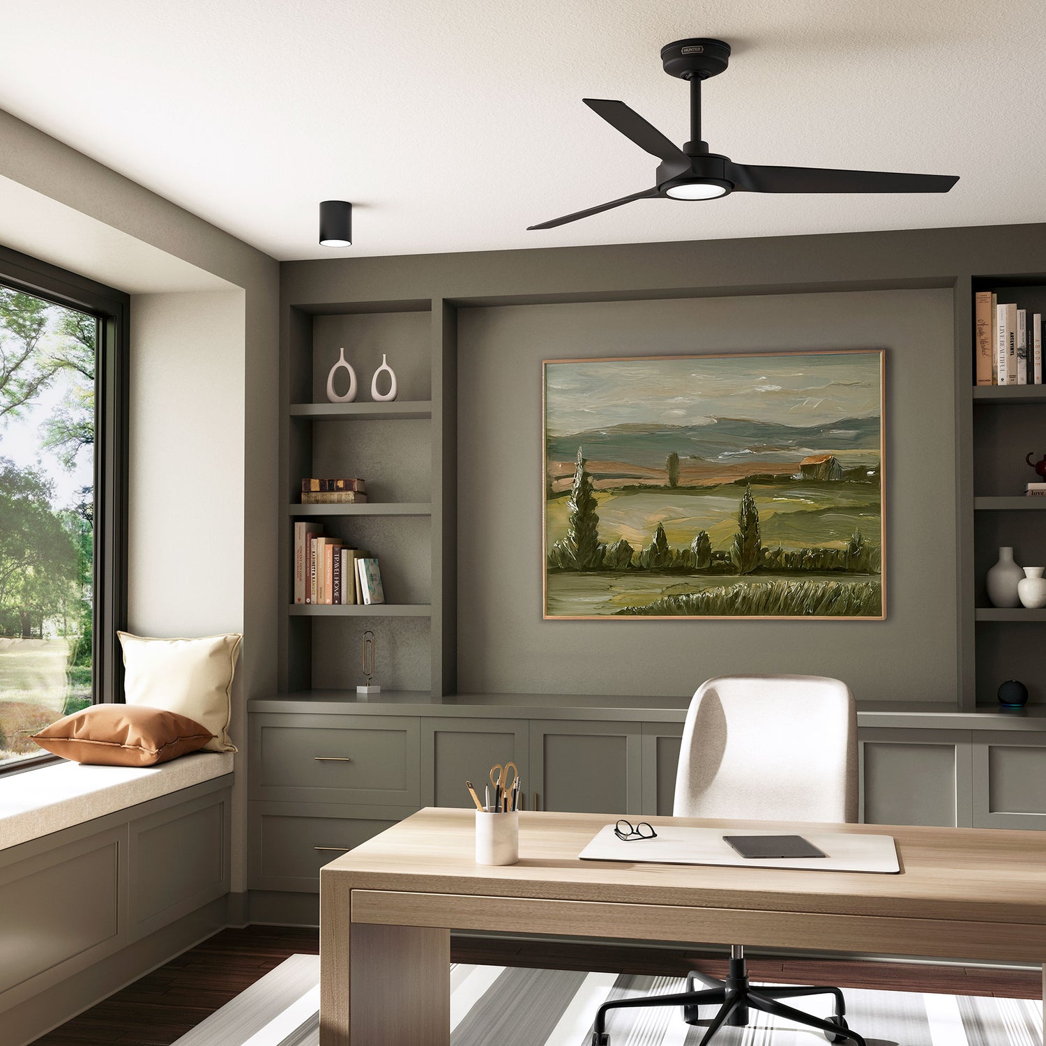 Modern home office with a desk, chair, ZenTech 3 blade ceiling fan and wall art.