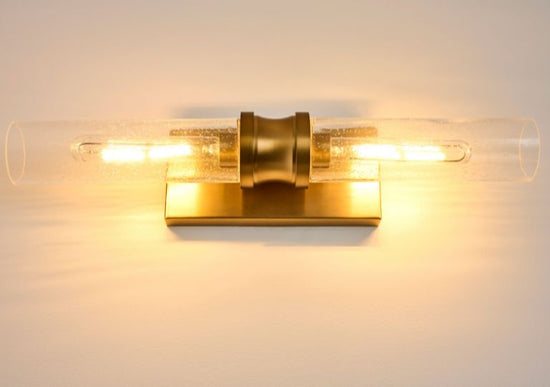 Lenlock clear seeded vanity light in a gold finish.