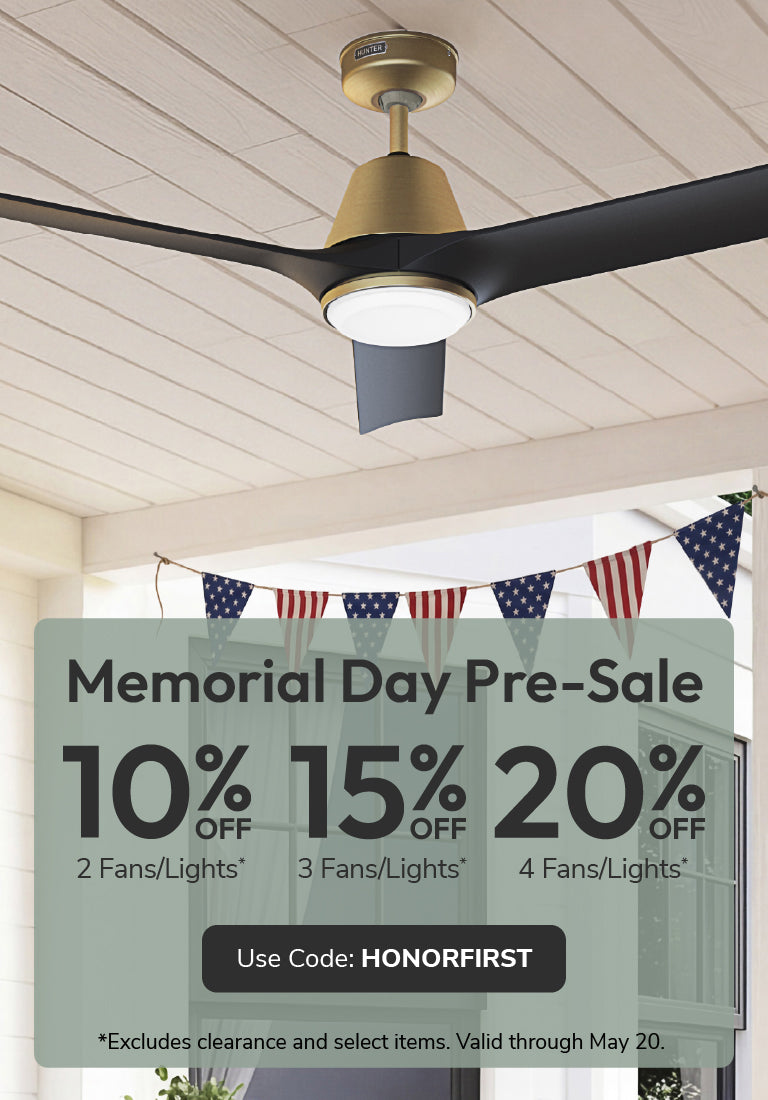 Ceiling fan with Memorial Day pre-sale sign on a porch with American flags.